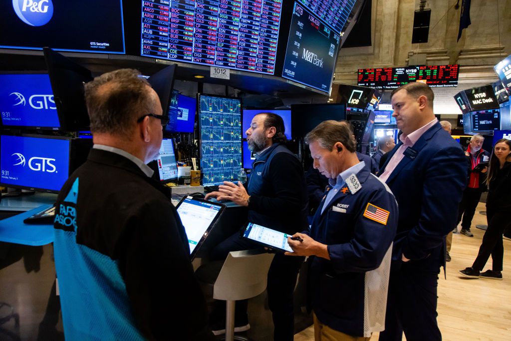 Traders work on the floor of the New York Stock Exchange