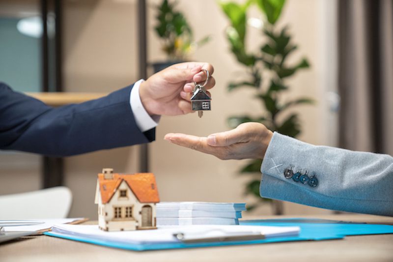 New homeowner being handed house keys