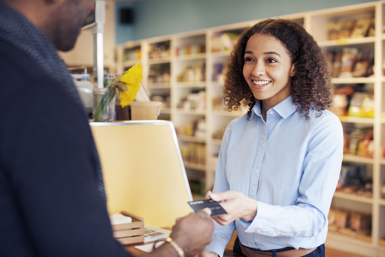 Customer paying at the store with debit card.