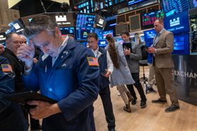 Traders work the floor of the New York Stock Exchange on Friday morning. 