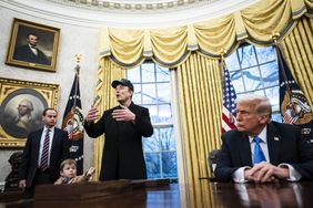 Elon Musk, center, with President Trump in the White House in February. 