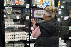 A woman looks at eggs for sale in a Giant grocery store in McLean, Virginia