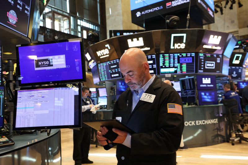 A trader works on the floor of the New York Stock Exchange (NYSE) at the opening bell in New York City, on May 27, 2025. 
