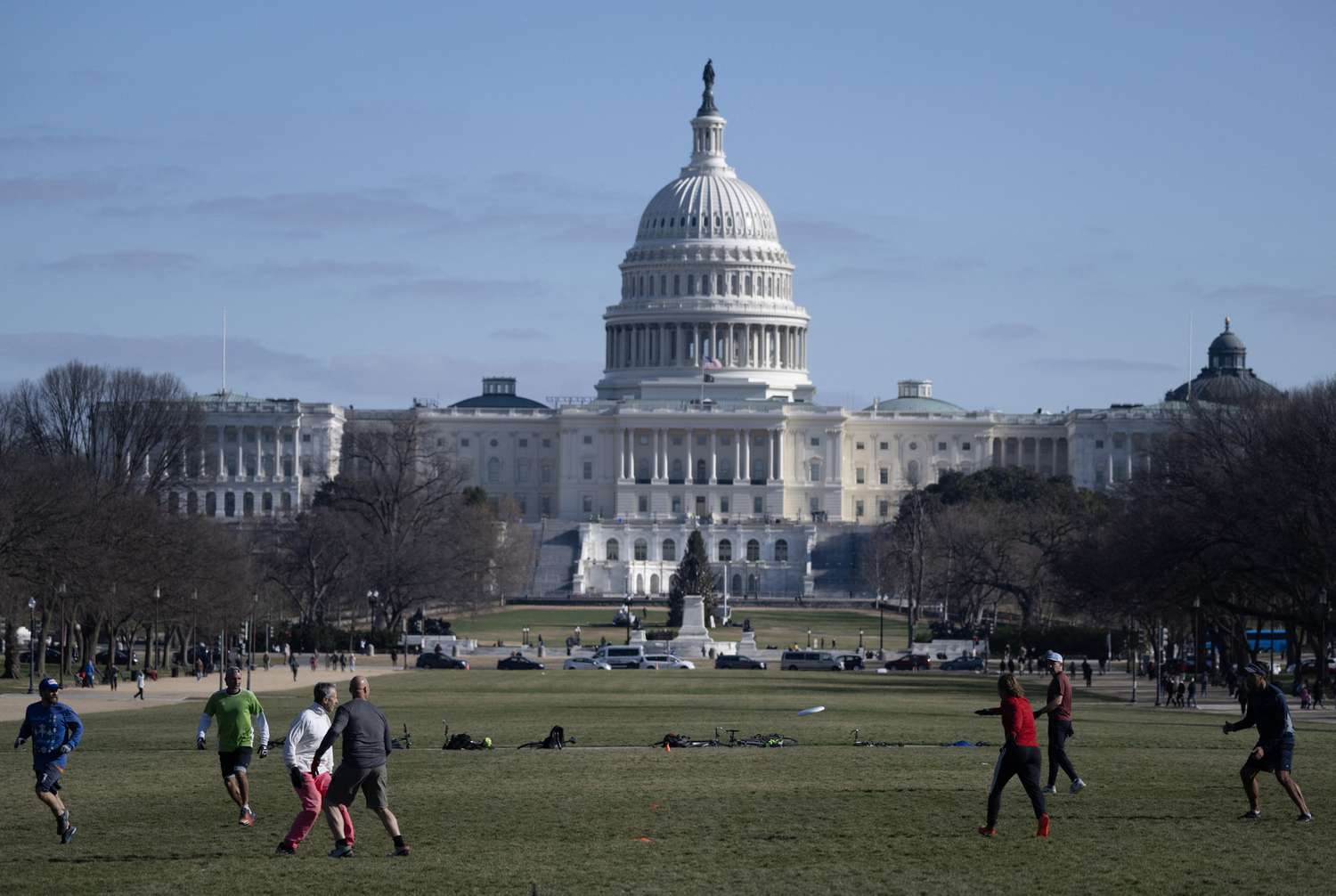 People play ultimate frisbee on the National Mall near the US Capitol in Washington, DC on January 2, 2024.