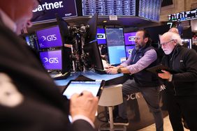Traders work on the floor of the New York Stock Exchange
