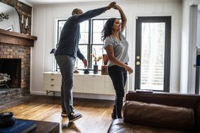 Couple dancing in their living room