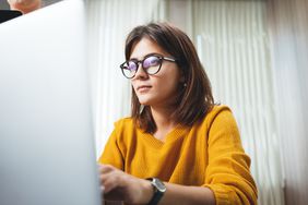 Portrait of businesswoman working on an office computer. 
