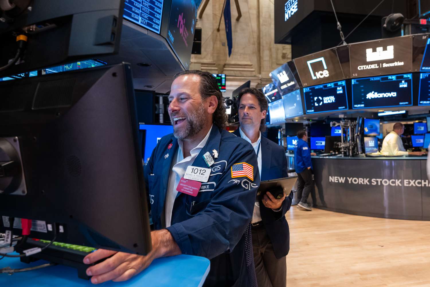 Traders work on the floor of the New York Stock Exchange
