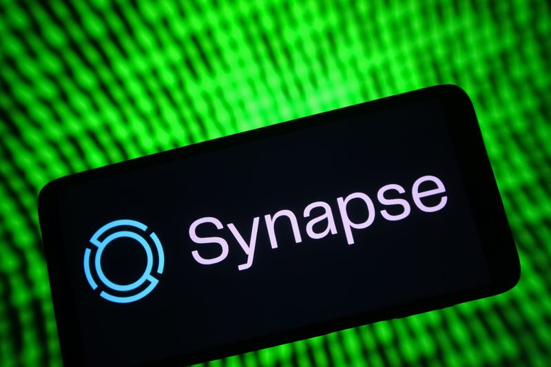 In this photo illustration, a Synapse Financial Technologies Inc. logo is seen on a smartphone screen. 