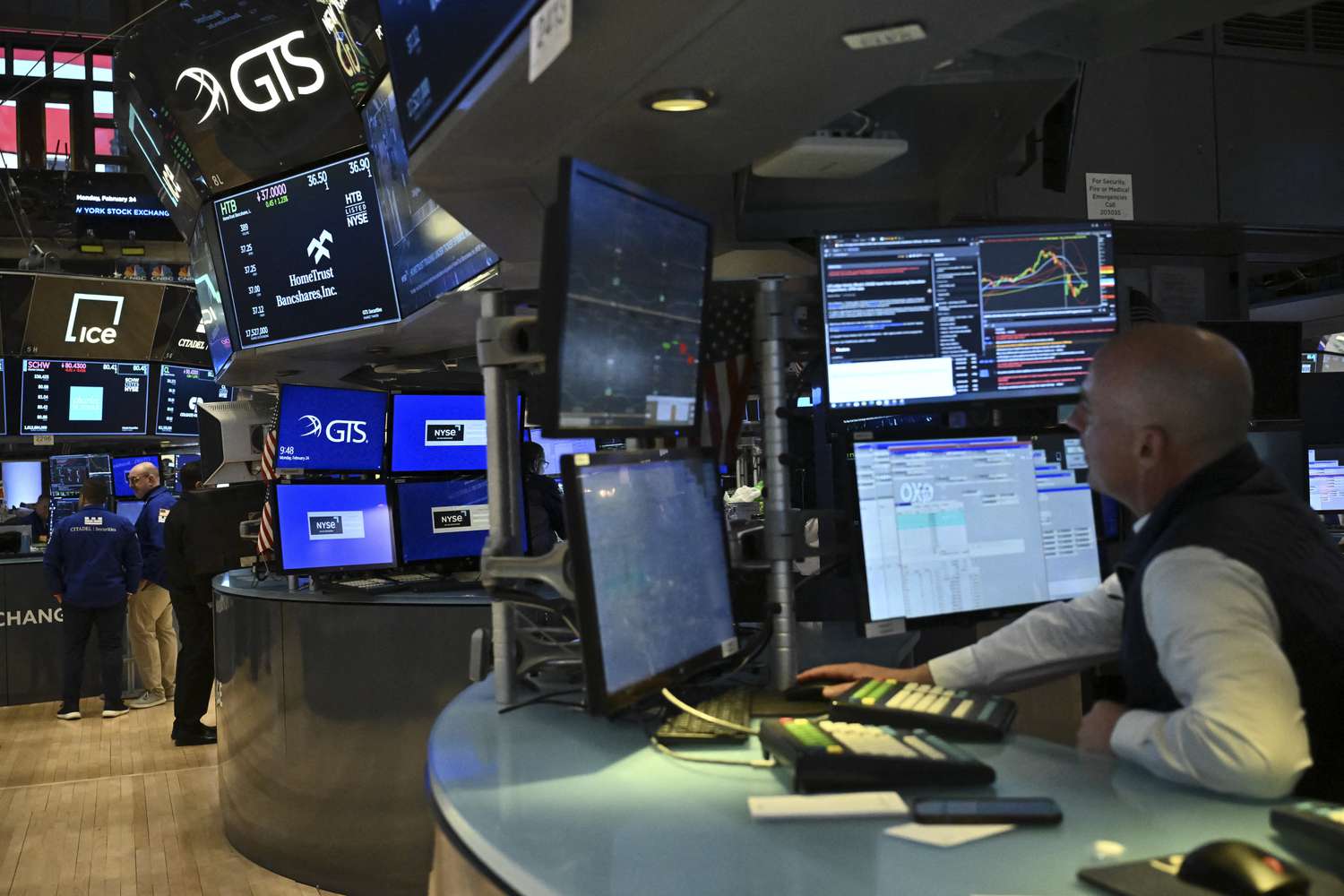 Traders work on the floor of the New York Stock Exchange