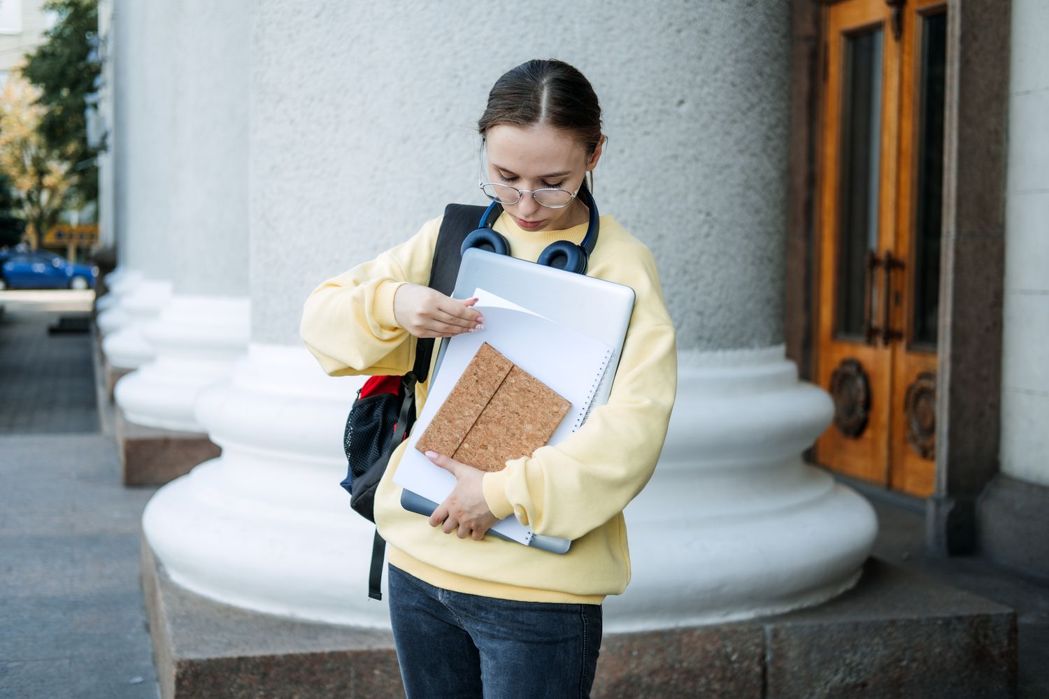Woman checking her notes about how to recovery from student loan default.