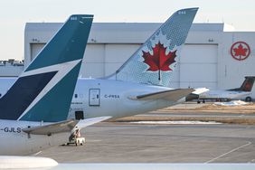 Air Canada and Westjet aircraft parked at Calgary International Airport