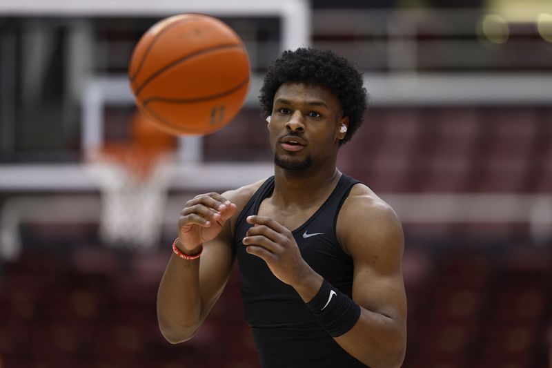 Bronny James of the USC Trojans warms up prior to the start of an NCAA basketball game.