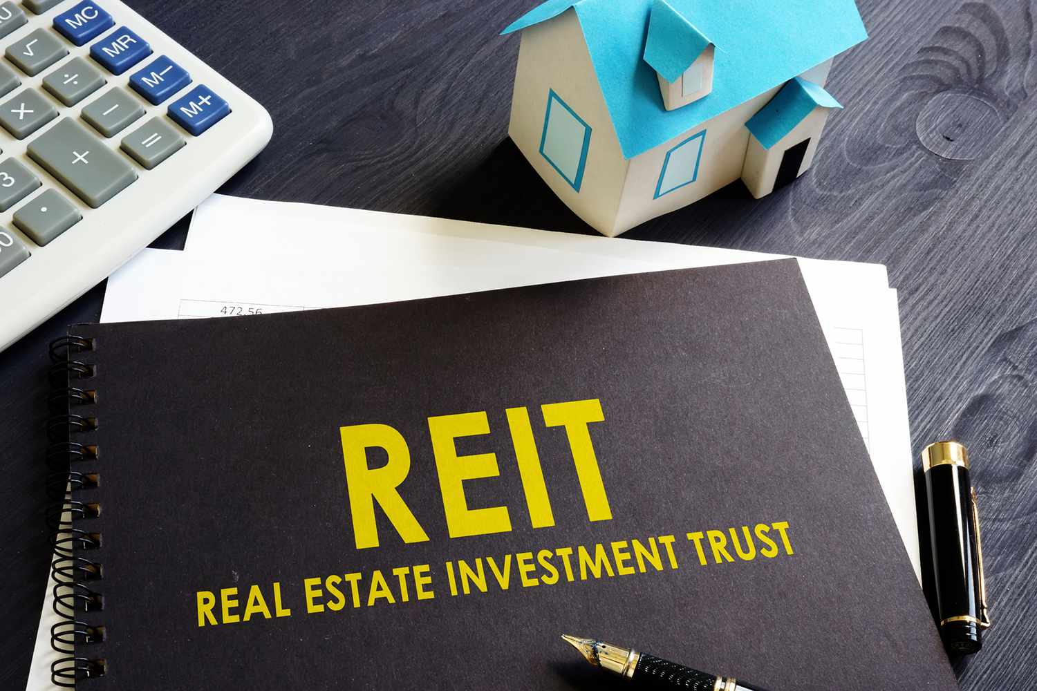 Real Estate Investment Trust REIT on an Office Desk