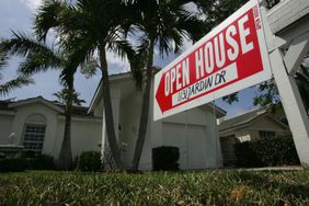 For sale sign in front of house in Florida