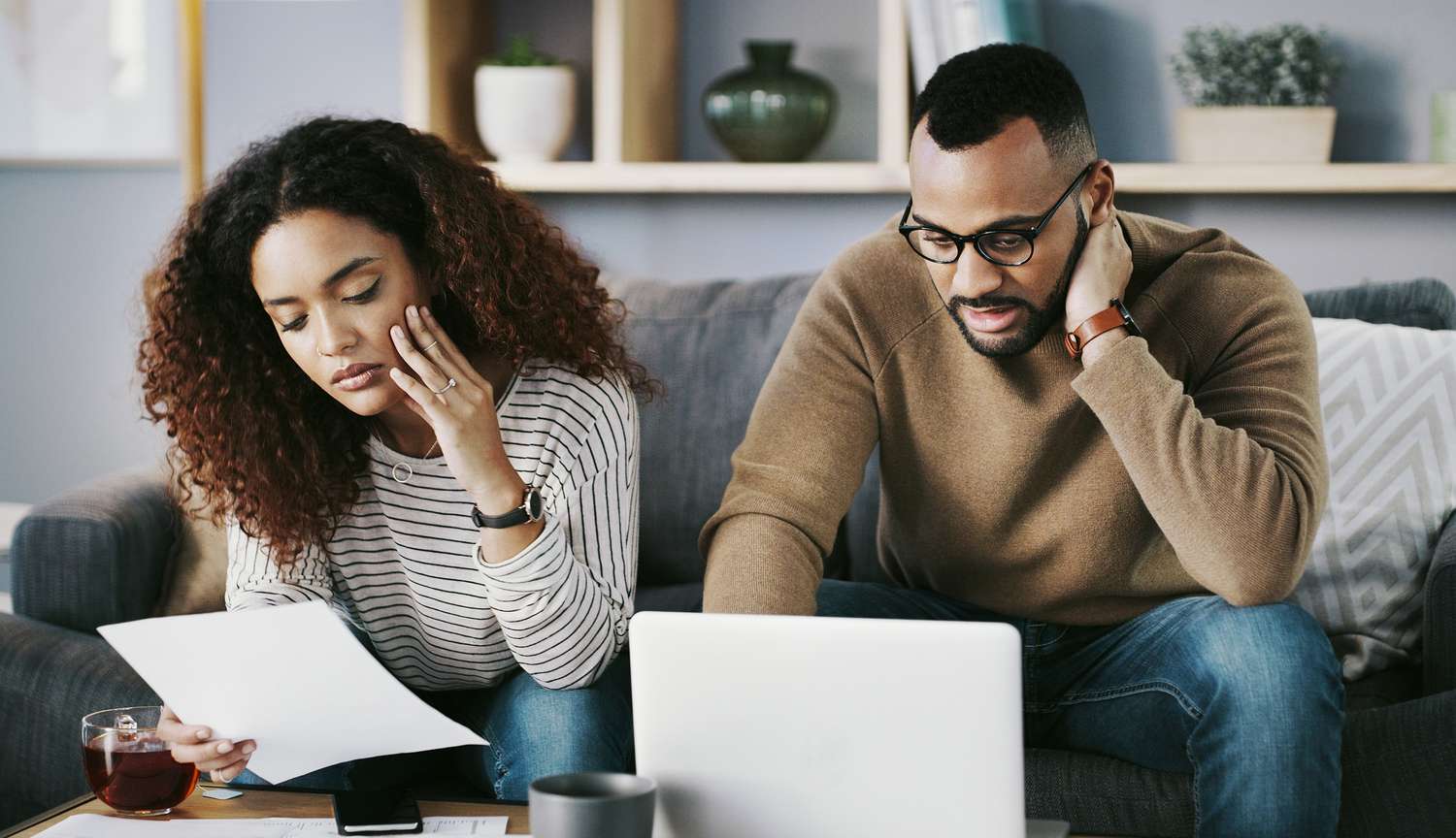 A couple looking at the medical debts listed on their credit reports.