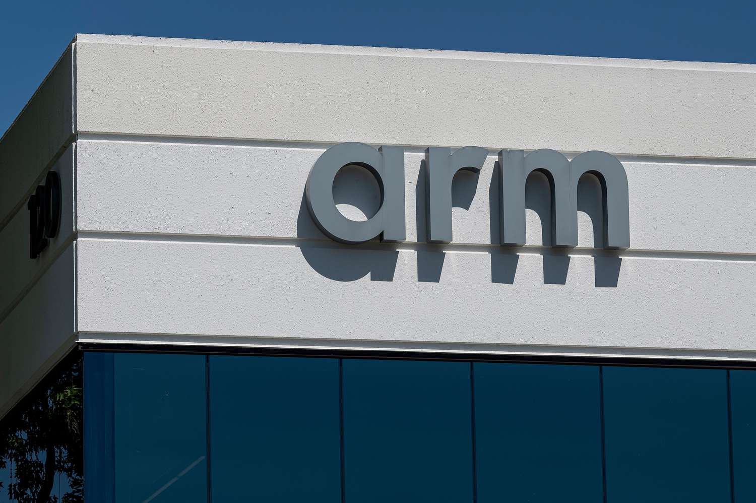 The Arm logo on display at a company building.
