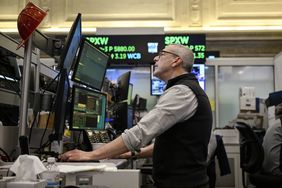 A trader works on the floor of the New York Stock Exchange/