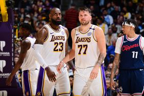 The Lakers' LeBron James, left, and Luka Doncic at a game earlier this month. 