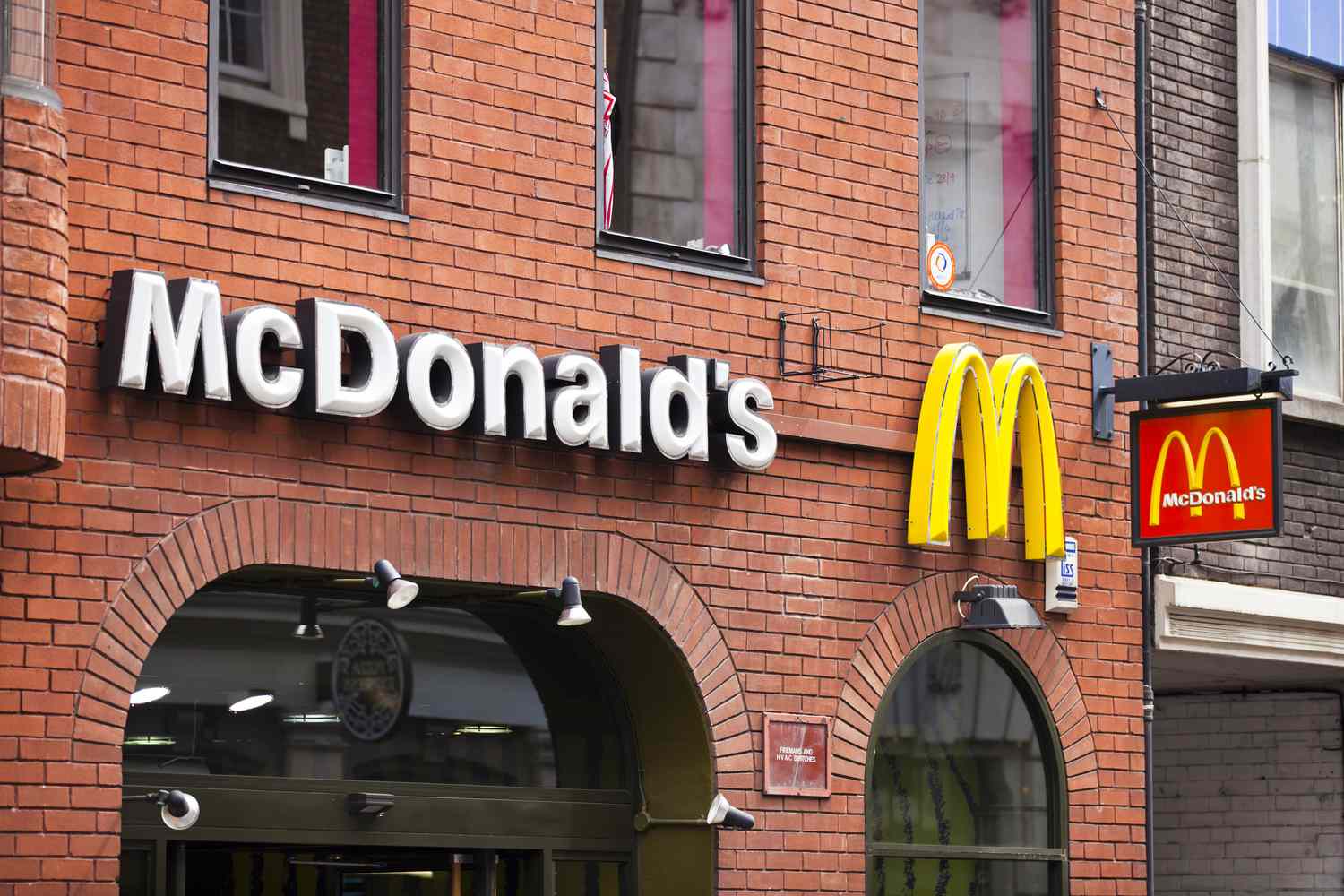 Sign with McDonald's logo over their restaurant in London