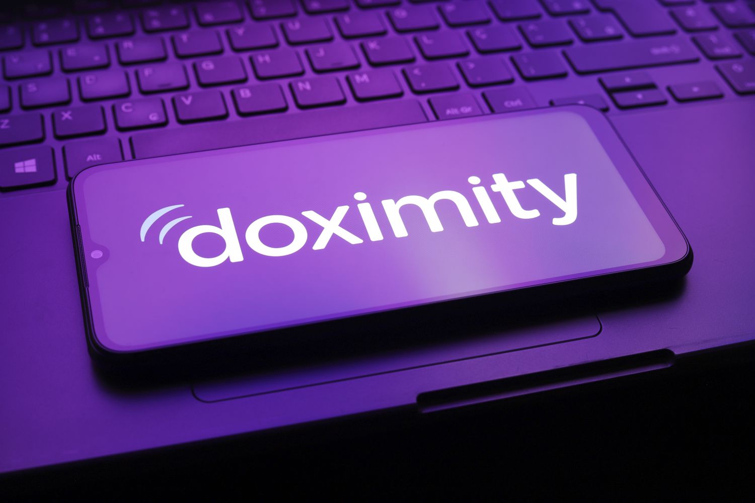 An illustration of the Doximity logo on a mobile device. 