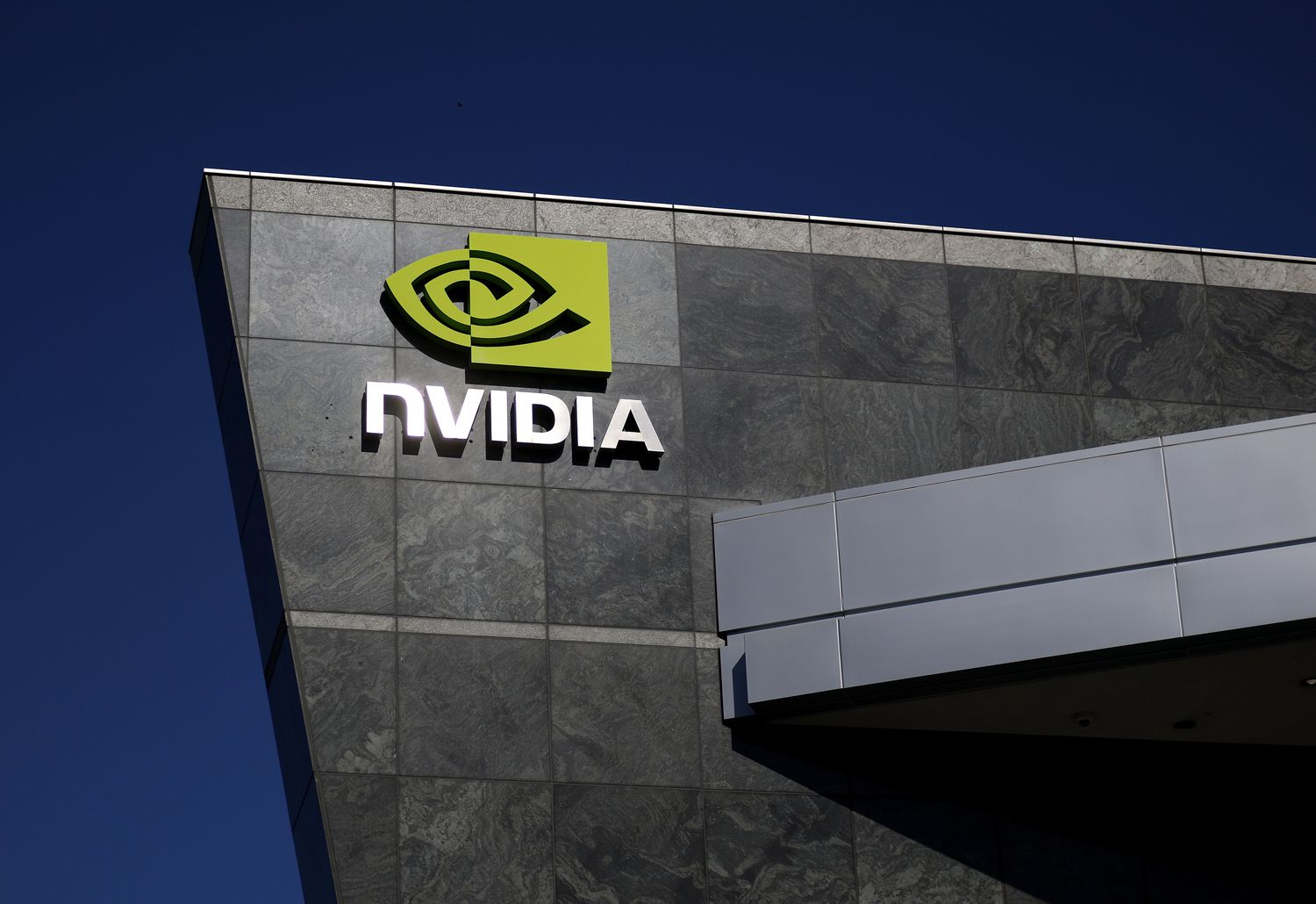 The Nvidia logo is displayed on a sign at the Nvidia headquarters on February 26, 2025 in Santa Clara, California. 