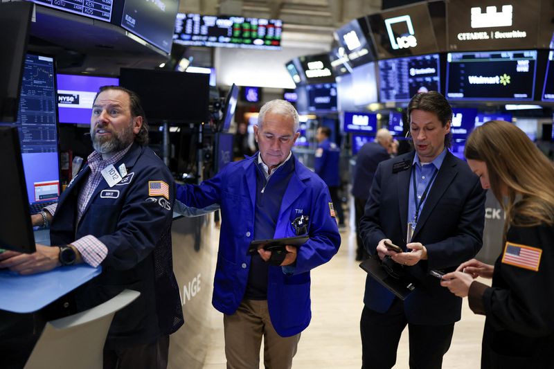 Traders work on the floor of the New York Stock Exchange 