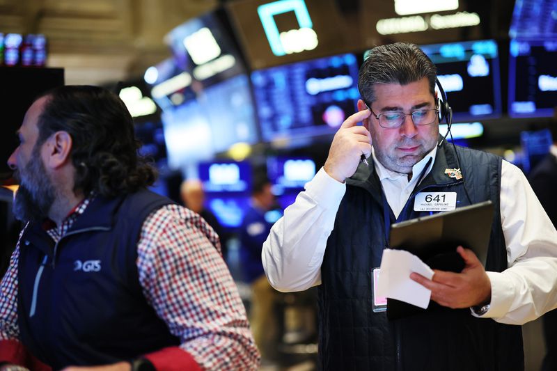 Traders work on the floor of the New York Stock Exchange