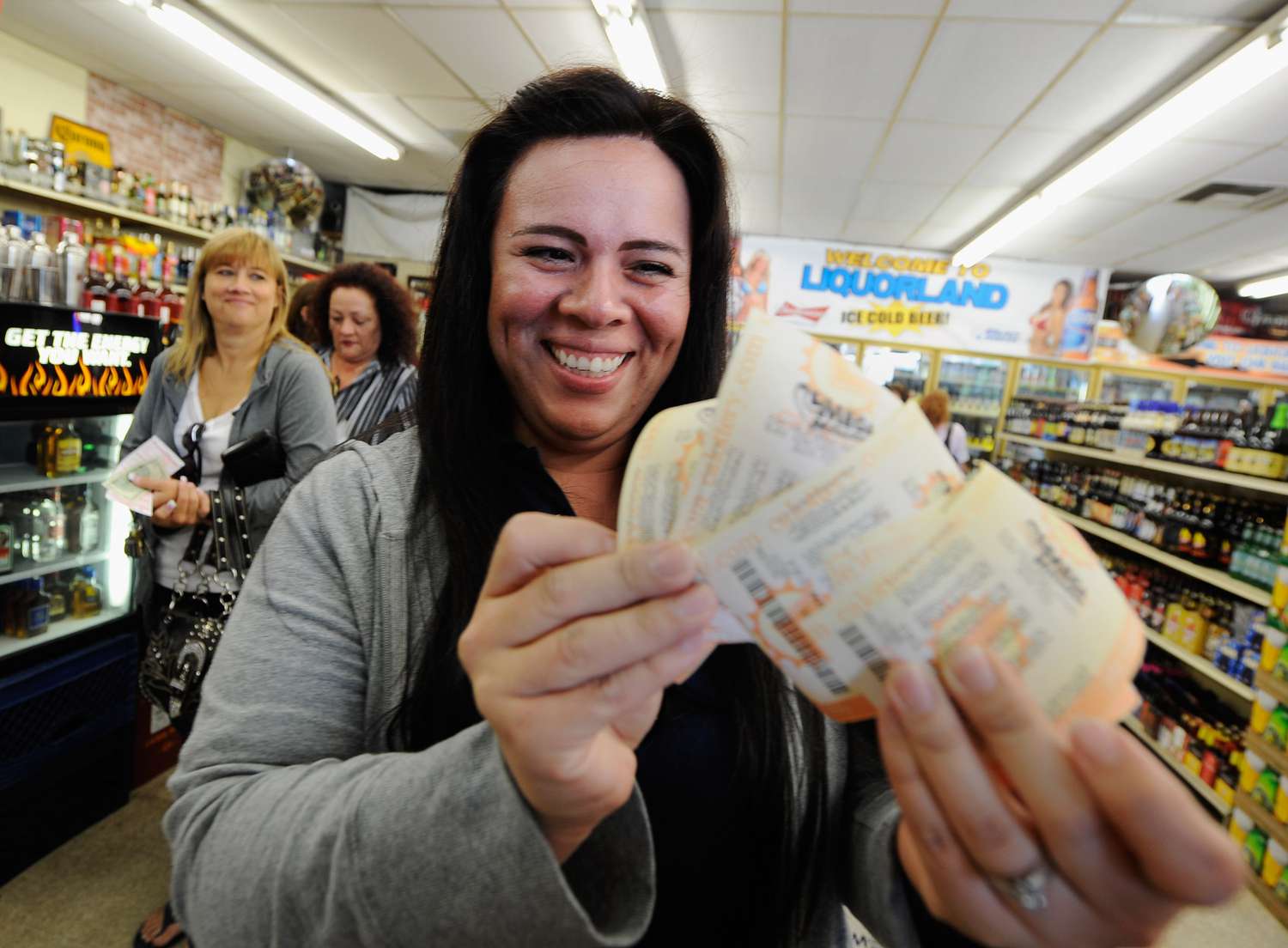 Image of a woman buying tickets for her lottery pool.