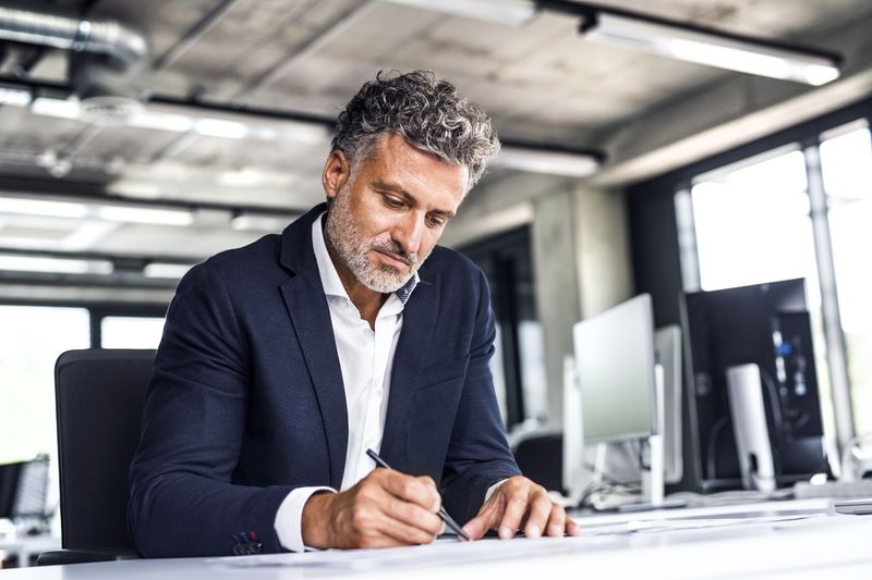 A business executive prepares documents.