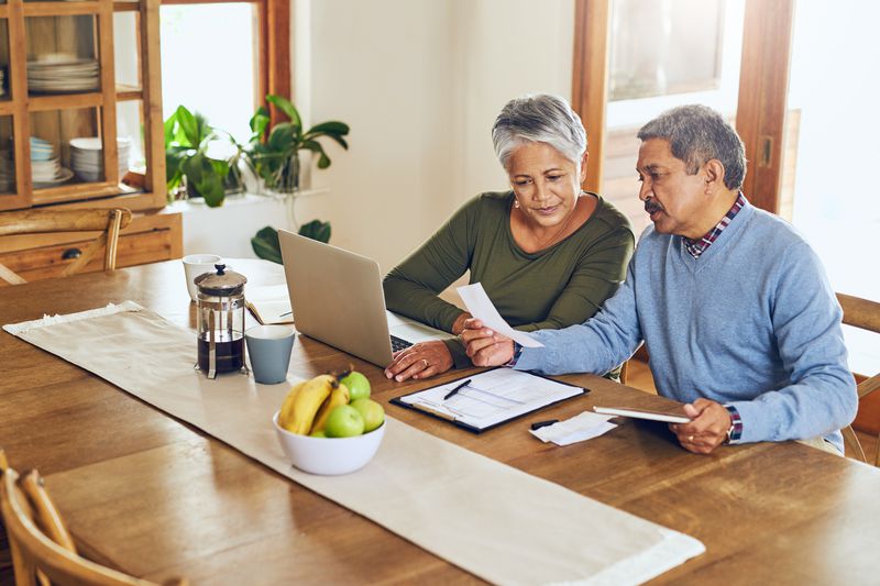 Couple sitting together financial work