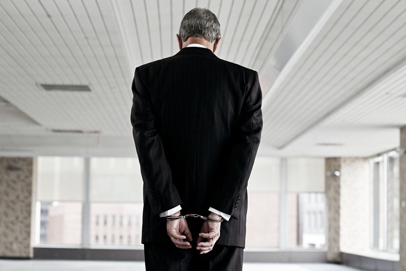 Businessman in handcuffs