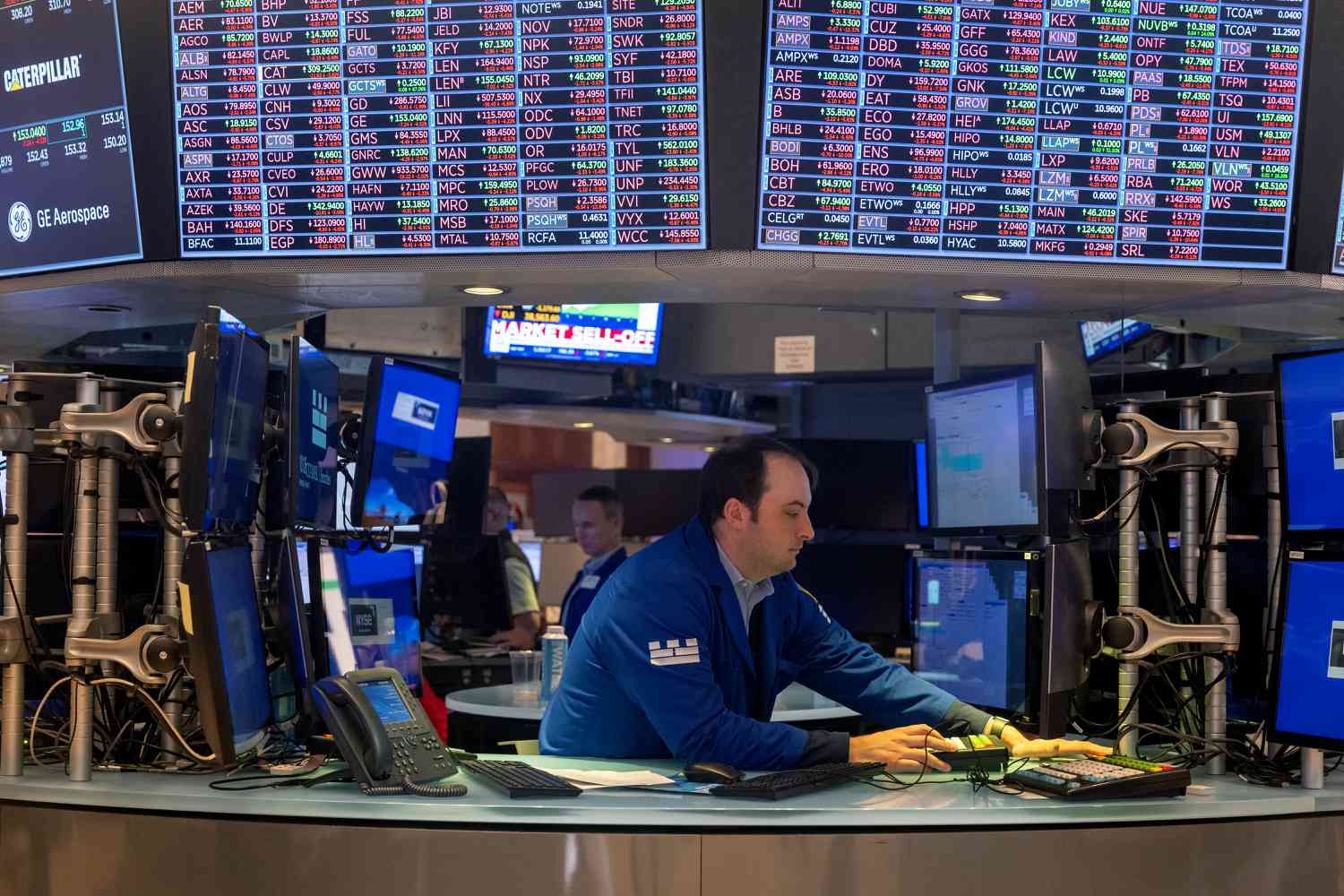 Traders work on the floor of the New York Stock Exchange (NYSE) on August 05, 2024, in New York City