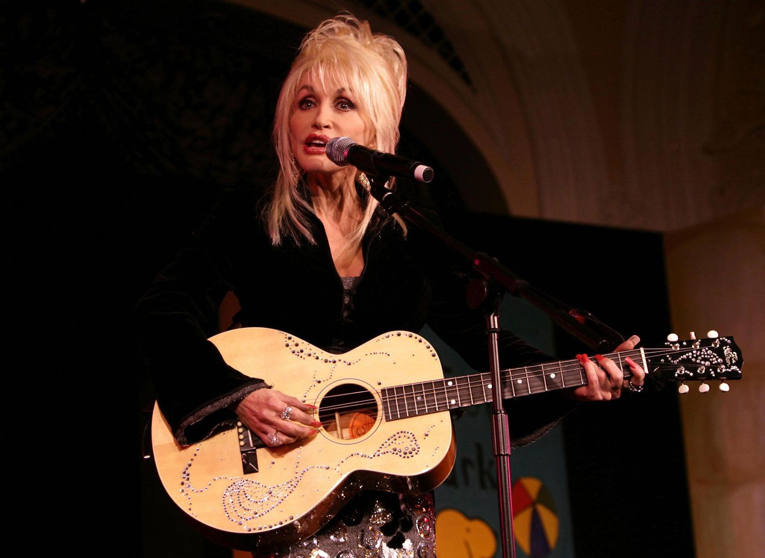 Dolly Parton performs at the launch of her Imagination Library of the United Kingdom - an educational initiative of her Dollywood Foundation that aims for every pre-school child to have their own library of books - at the Savoy Hotel in central London.