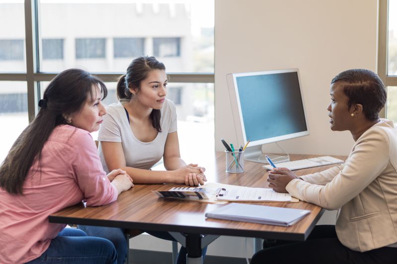 Banker talking to family