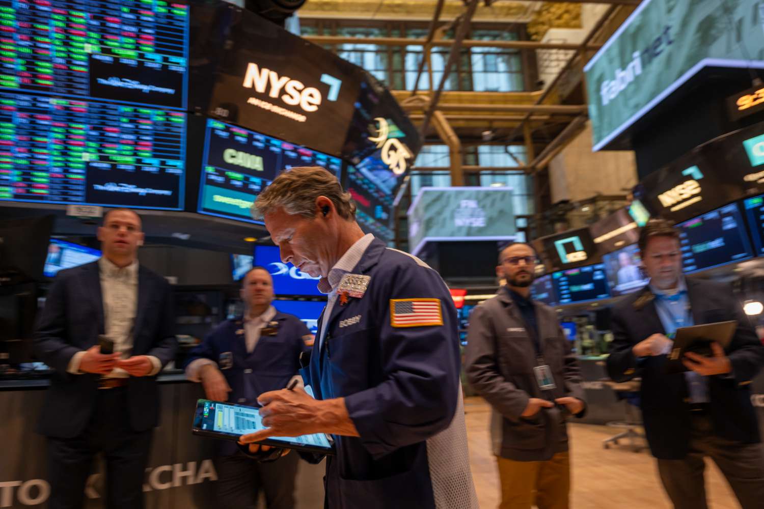 Traders work on the floor of the New York Stock Exchange.