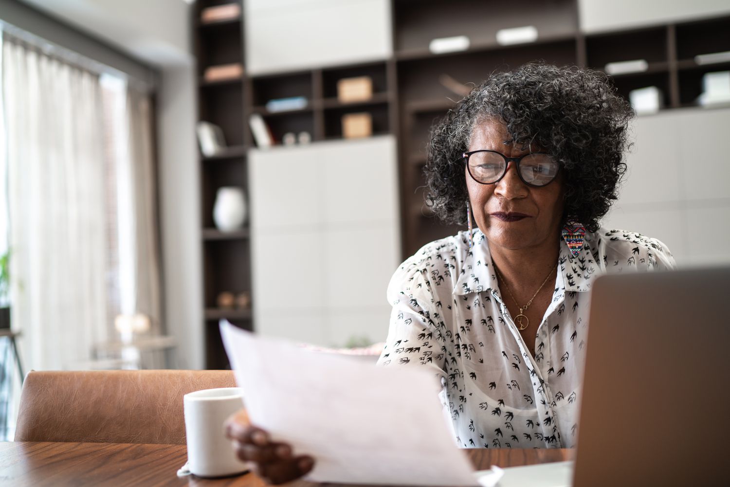 Woman considering the lifetime cost of a major purchase