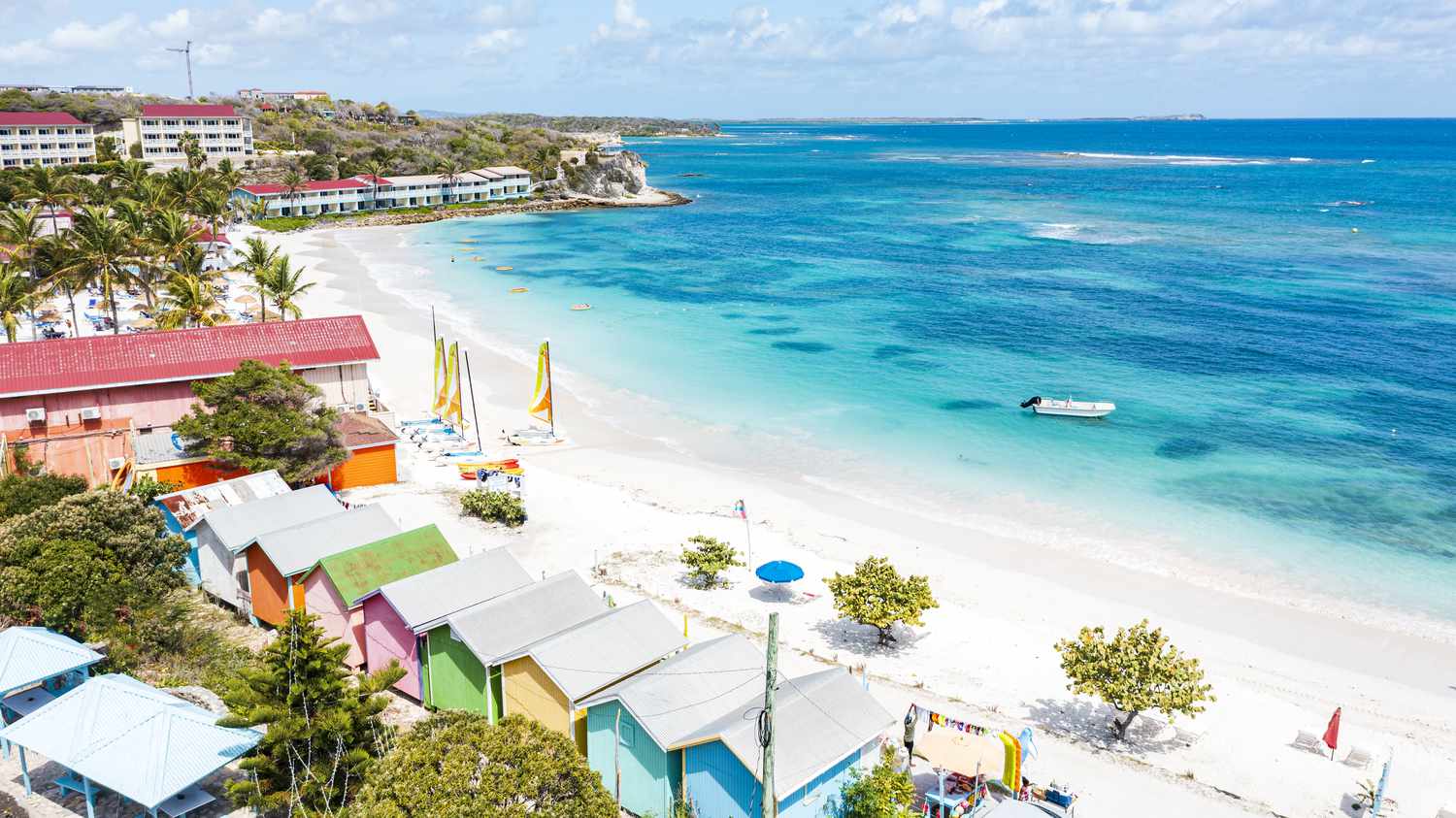 Luxury tourist resort on white sand beach by the crystal Caribbean Sea, Long Bay, Antigua, Leeward Islands, West Indies