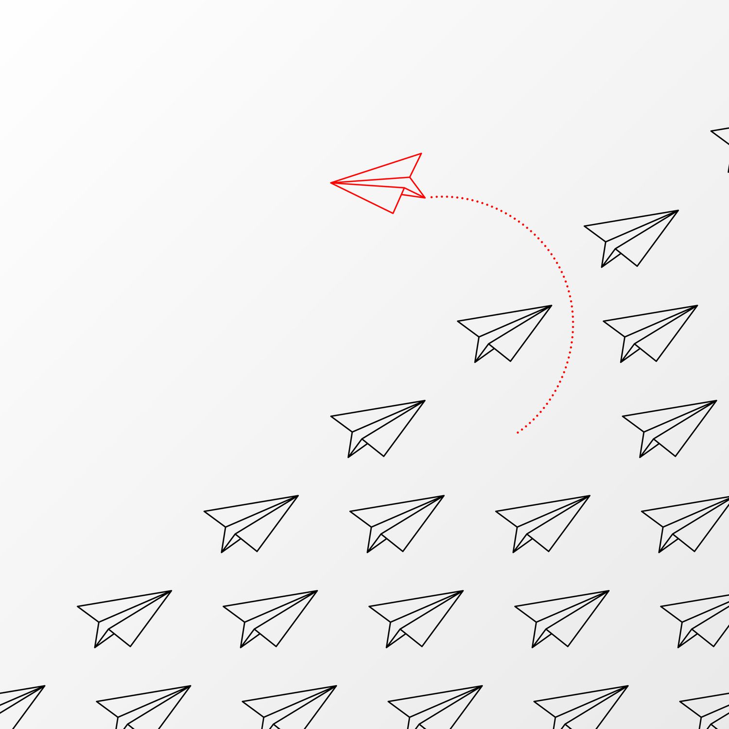 A lone red paper airplane separating from a pack