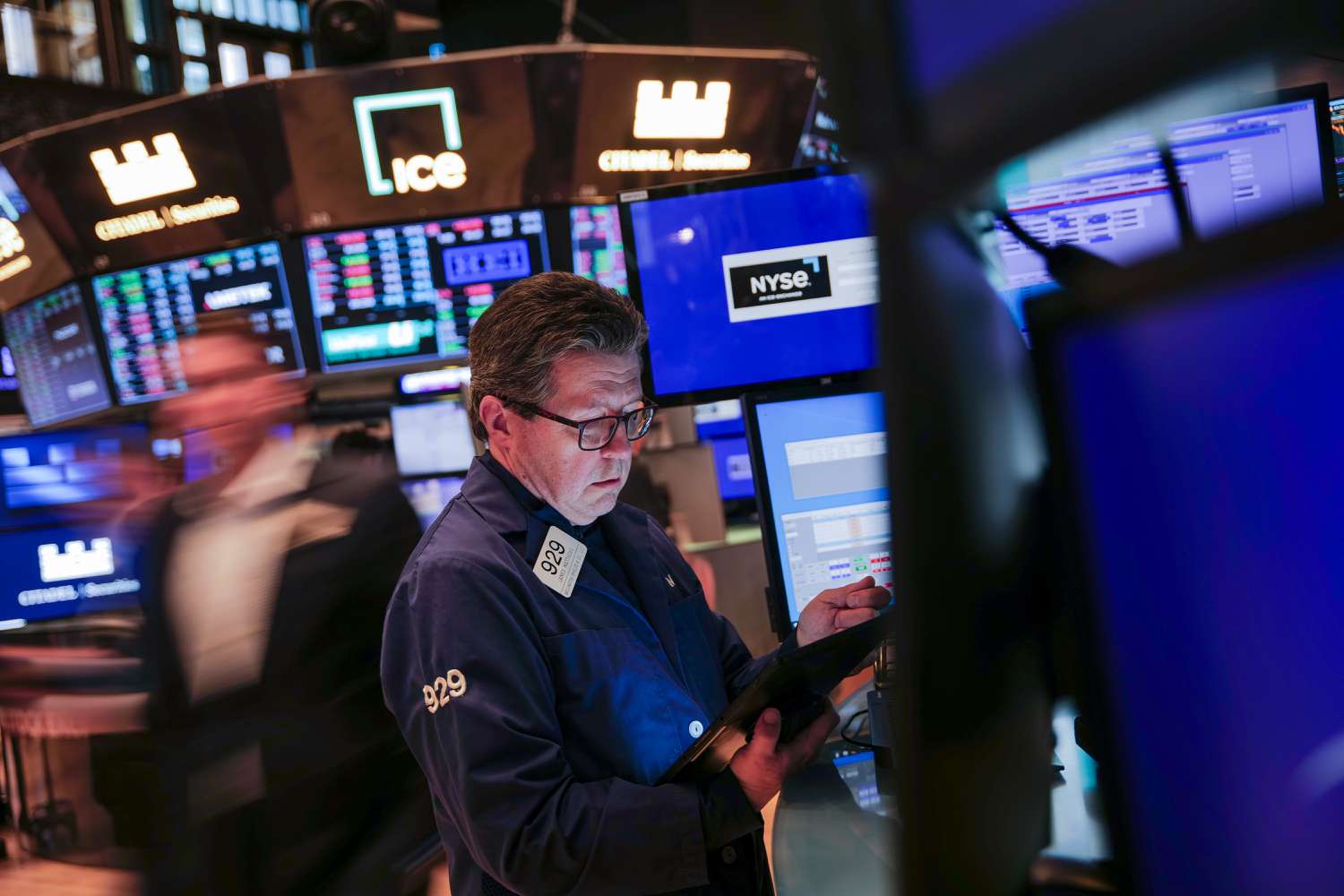 Traders work on the floor of the New York Stock Exchange