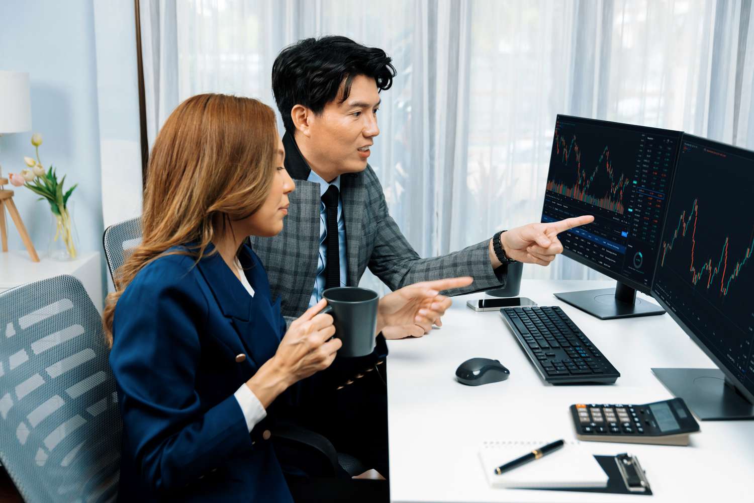Experienced mentor showing beginner stock trader how to buy call options.