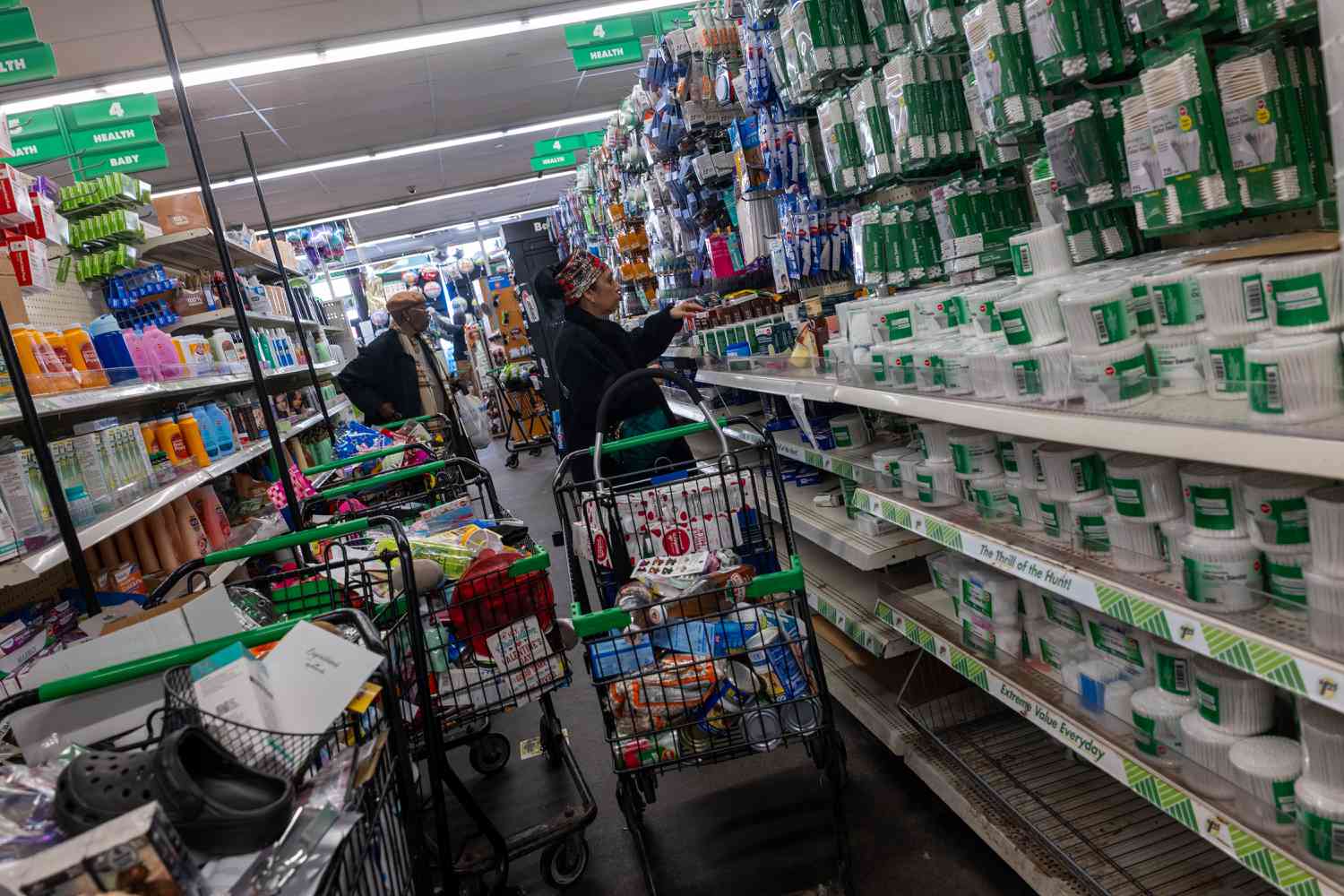 People shop in a Dollar Tree store in Brooklyn on March 26, 2025 in New York City.