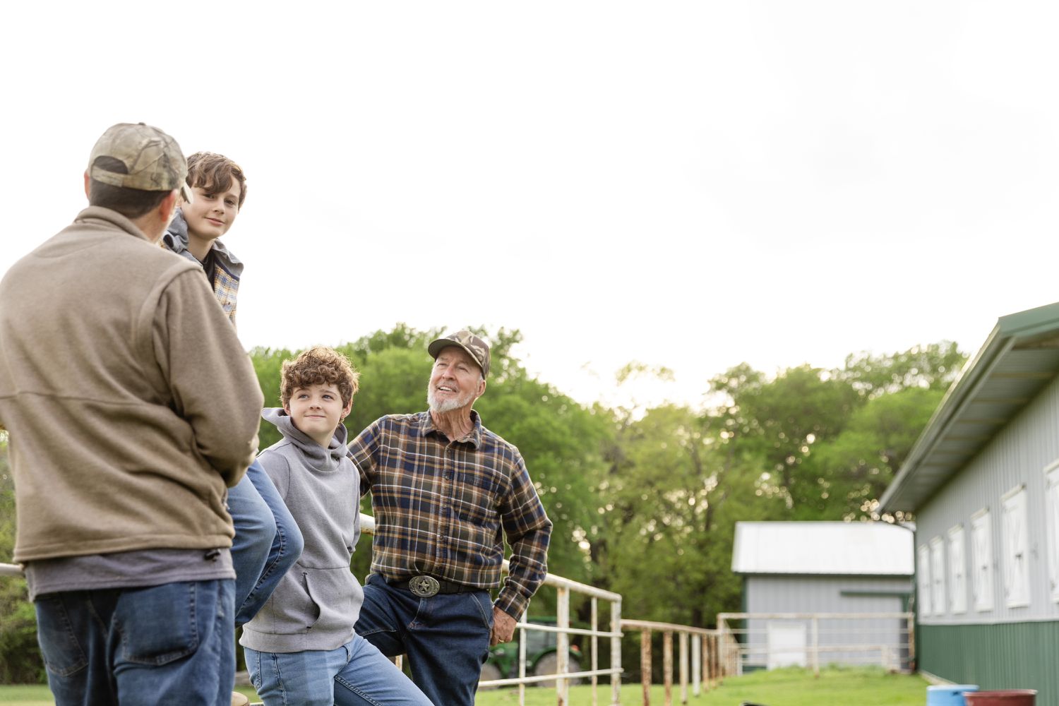 Farming family by a fence