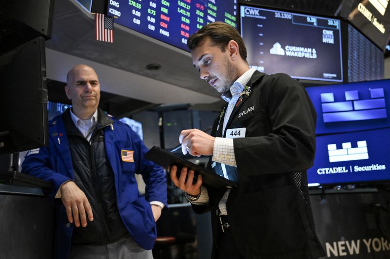 Traders work on the floor of the New York Stock Exchange
