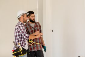 Engineer inspecting a house under construction.