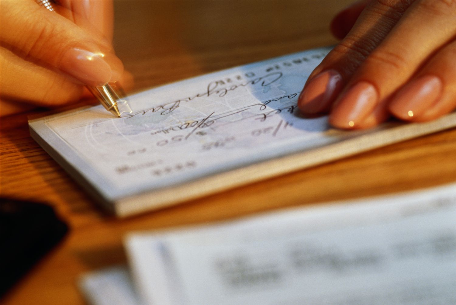 Woman Writing a Check