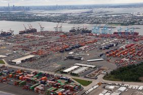 Cargo ships are unloaded at the Maher Container Terminal and APM Terminal on Newark Bay across from lower Manhattan in New York City on June 1, 2025, in Newark, New Jersey.