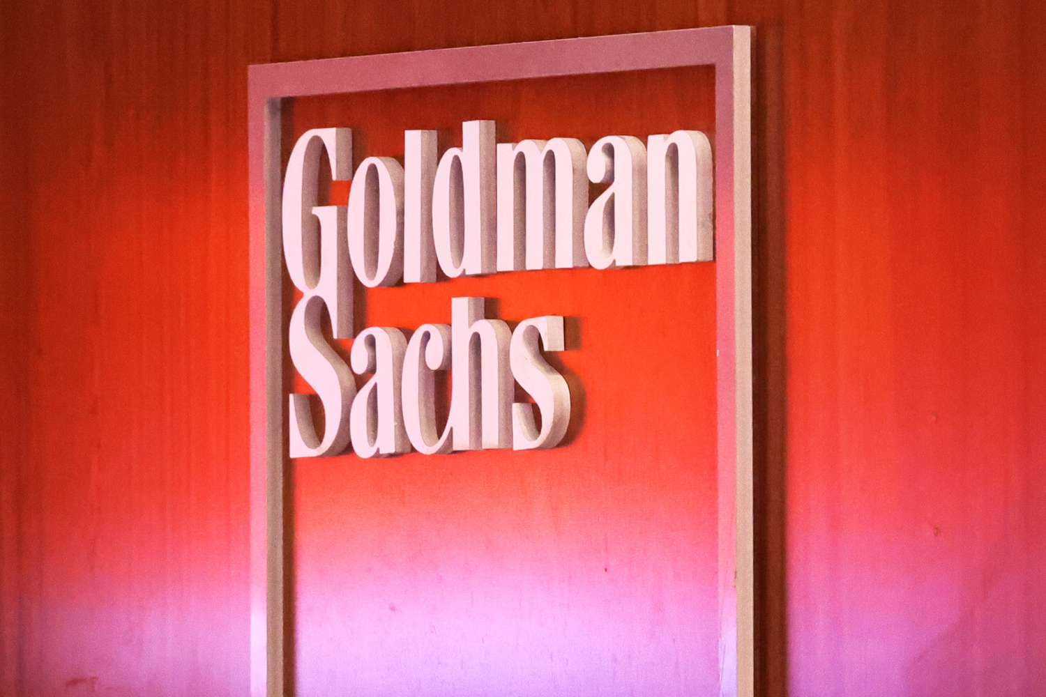 The Goldman Sachs logo on an office wall