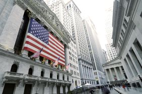 Flags are displayed on the outside of the New York Stock Exchange. 