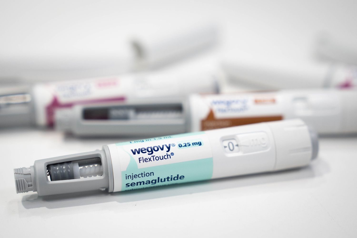 A group of Wegovy injection pens sit on a table